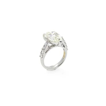 Pear shape engagement ring with shoulder diamonds