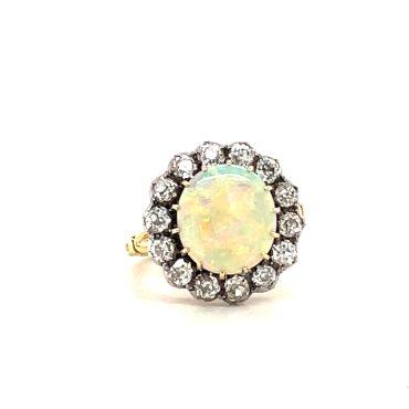Opals can display all the colours of the rainbow in an iridescent, surrounded by a sea of diamonds.