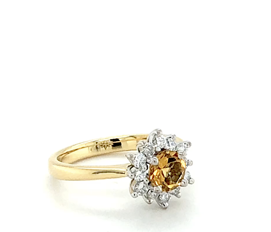 Yellow Gold Engagement Ring With Pear Shaped Diamonds surrounding the Yellow Diamond In The Centre