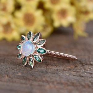 opal engagement ring, emerald gemstones