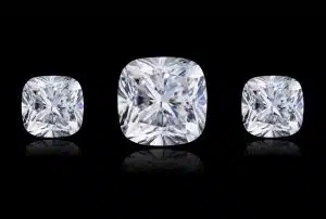 Three sparkling cushion-cut diamonds